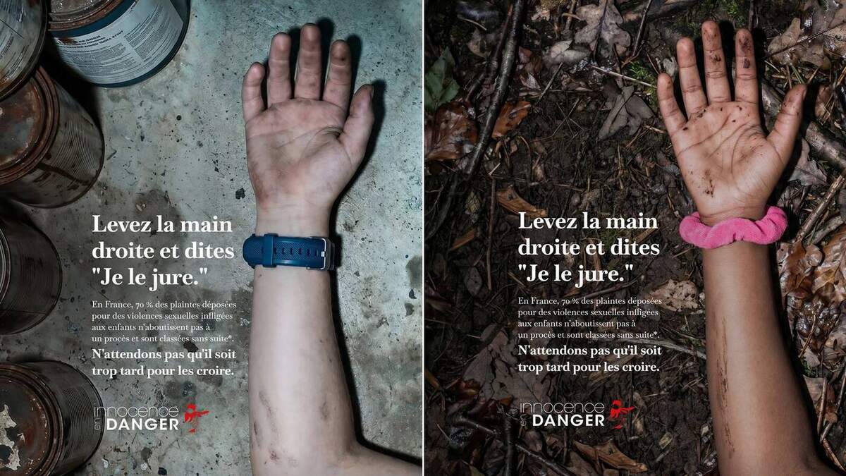 Visuel principal de la campagne Innocence en Danger signée Babel dévoilée le 18 juin 2026, photographie en lumière naturelle d'une main d'enfant retombée au sol paume ouverte sur un dallage gris poussiéreux jonché de débris, un chouchou rose pâle au poignet et bracelet de perles colorées