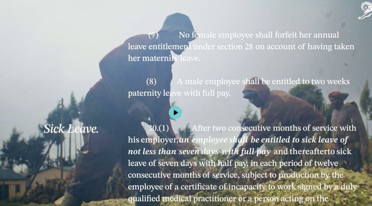 Photogramme d'illustration du dispositif Paid Sick Leave for Cows signé The Partnership Agency Nairobi pour Too Good, mise en page typographique surimposée sur une photo couleur d'un éleveur kényan vêtu d'un manteau marron qui étreint une vache laitière noire et blanche dans une prairie, à gauche en bas la mention manuscrite stylisée Sick Leave en italique blanc, à droite extraits en lettres blanches sérigraphiées du règlement officiel kényan article 28 sur les droits aux congés payés et l'arrêt maladie